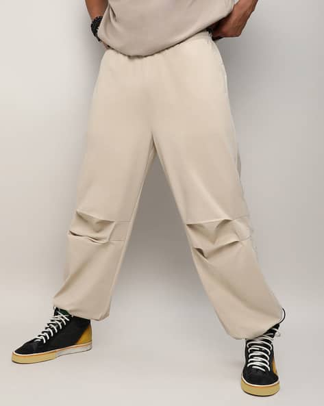 Buy Off-White Trousers Pants for Men by Campus Sutra Online