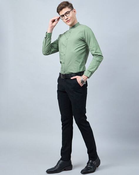 green dress shirt blue pants green shirt blue pants yellow necklace