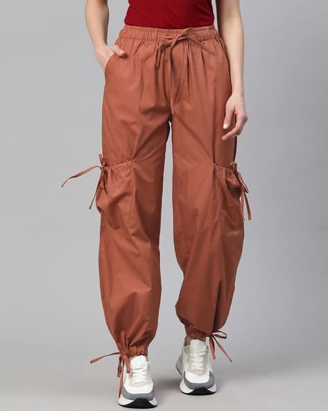 Buy Rust orange Trousers Pants for Women by Popnetic Online