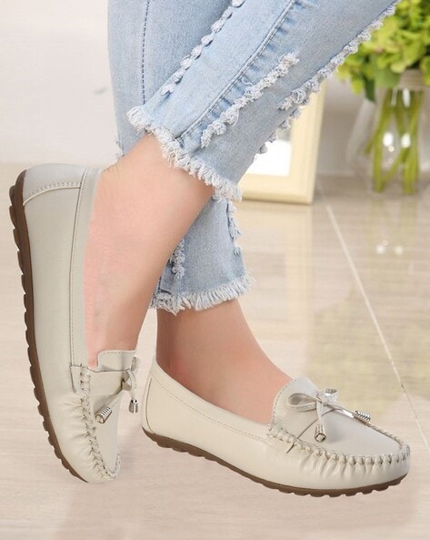 Ladies cream flat shoes best sale