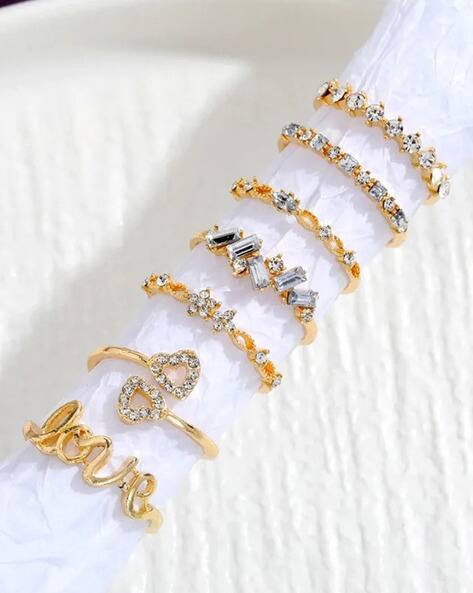 Jewels galaxy Women Set of 7 Gold-Plated Stone-Studded Stackable Finger Rings