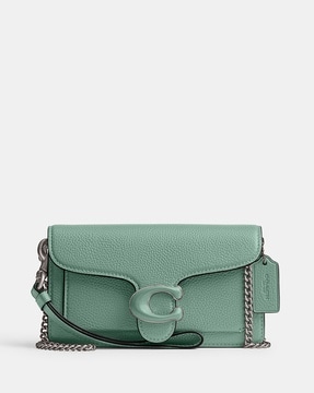 Coach store Green Crossbody Purse with Limited Edition Dinosaur and Feather Pendants