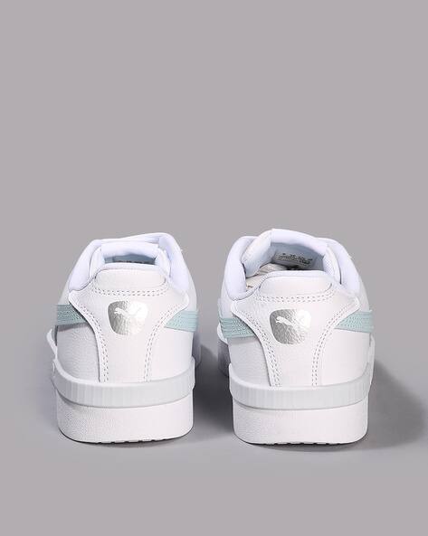 white puma shoes with black stripe