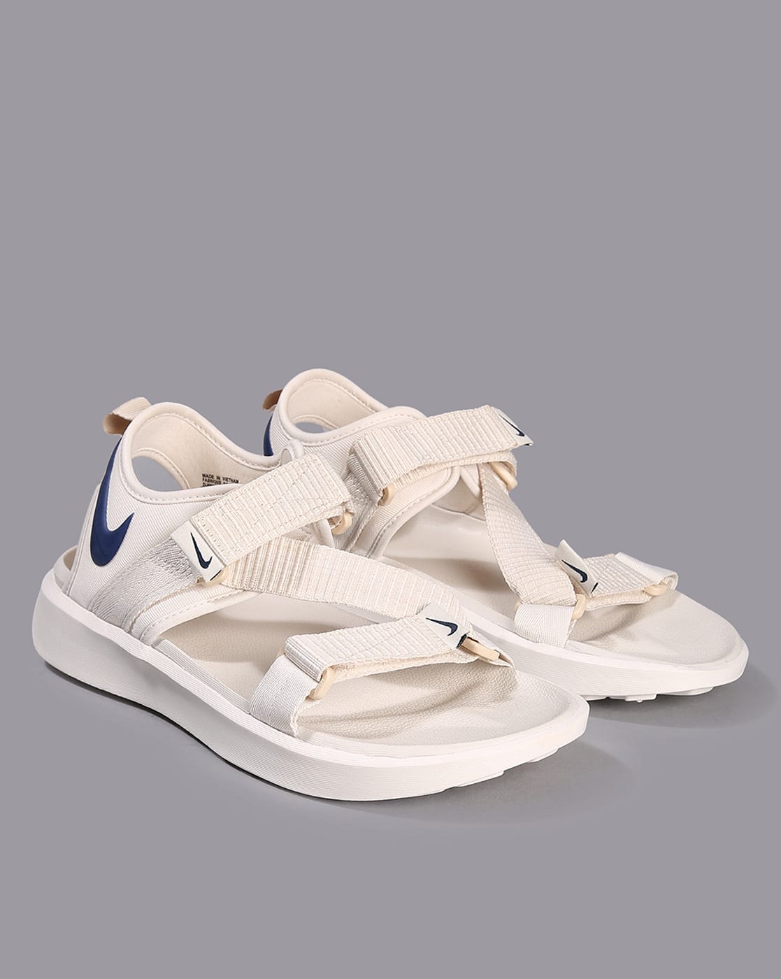 grey and white nike sandals