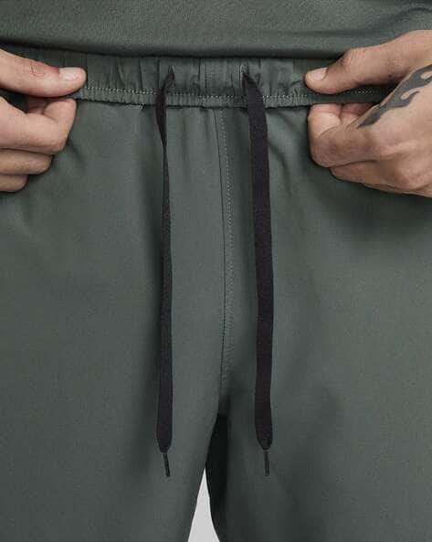 Buy Green Track Pants for Men by NIKE Online