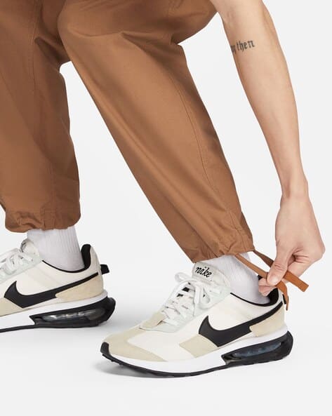 nike track pants brown
