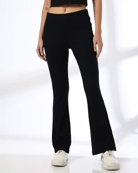 Teamspirit Women Ribbed Flared Track Pants deal from ajio