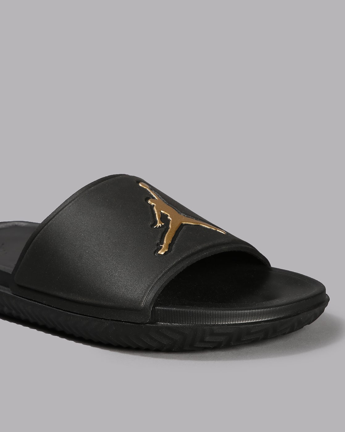 jordan sandals black and gold