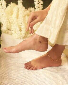 women kundan studded anklets with gold beads