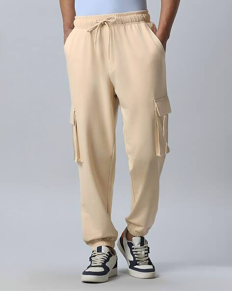 Buy Beige Track Pants for Men by MANIAC Online | Ajio.com