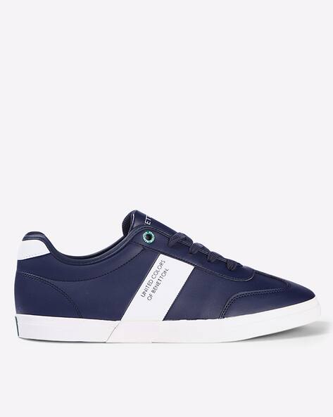 navy blue and white sneakers