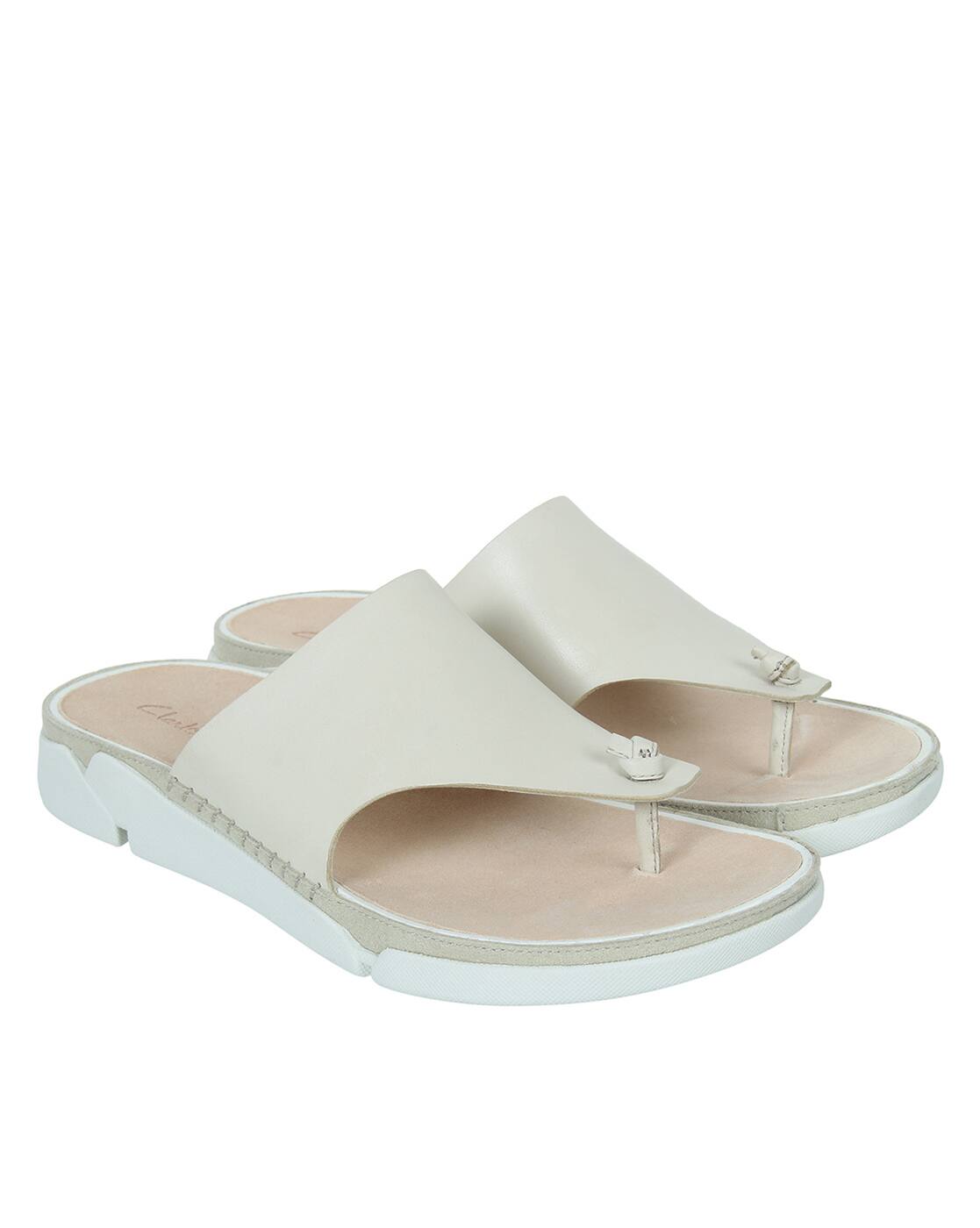 white flat slip on sandals
