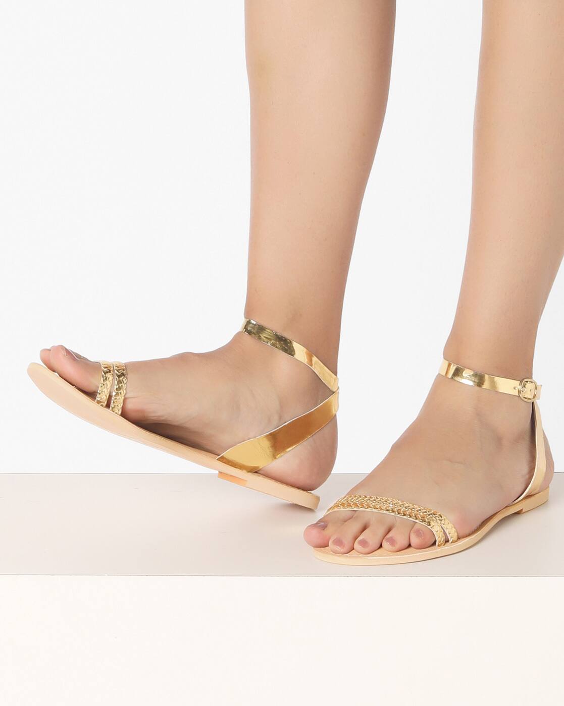 gold flat sandals with ankle strap