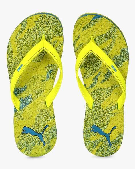 puma yellow slippers