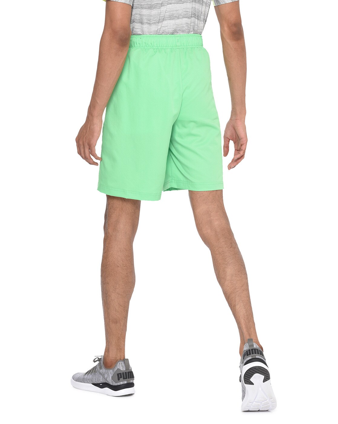 green puma shorts
