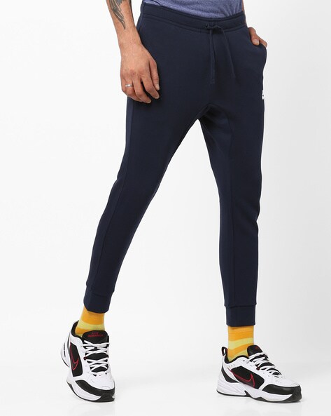 navy blue nike track pants