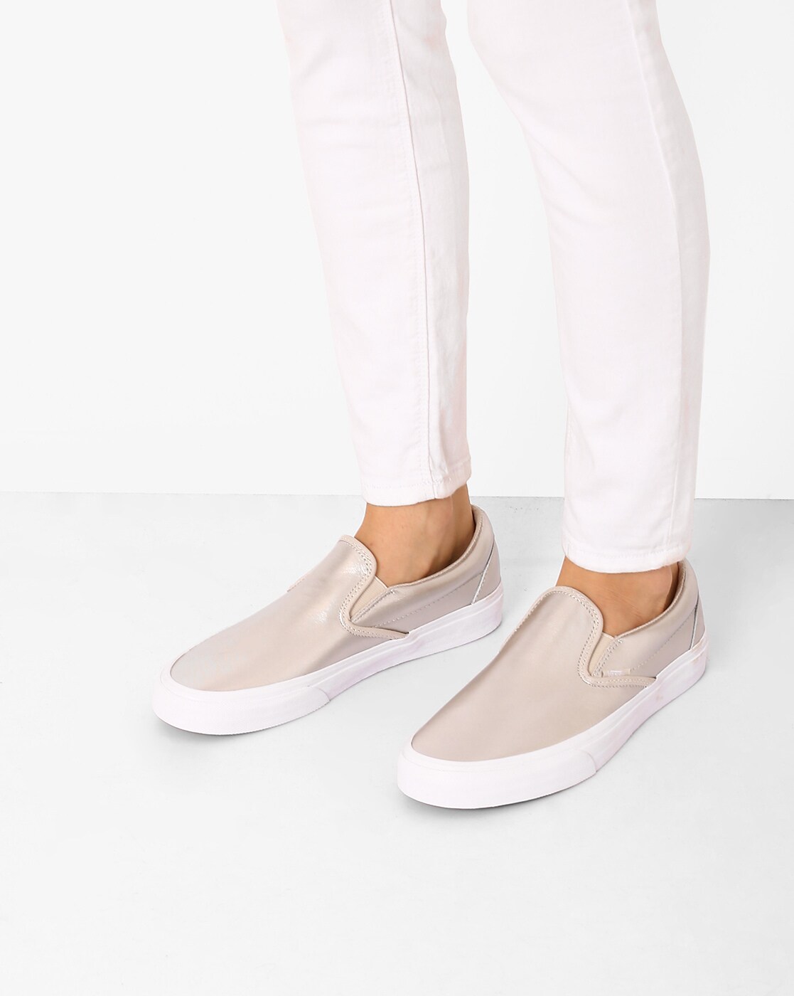 cream colored slip on vans