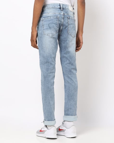 Heavy-Wash Slim Fit Low-Rise Jeans (Image - 1)