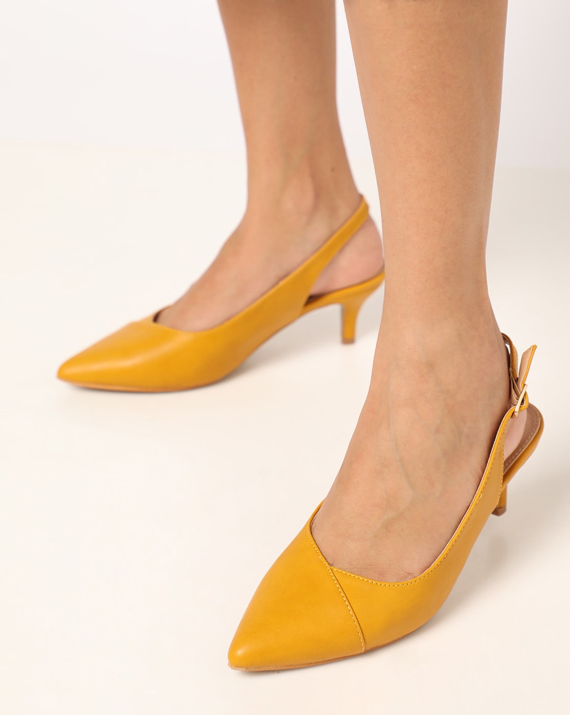 yellow heeled shoes