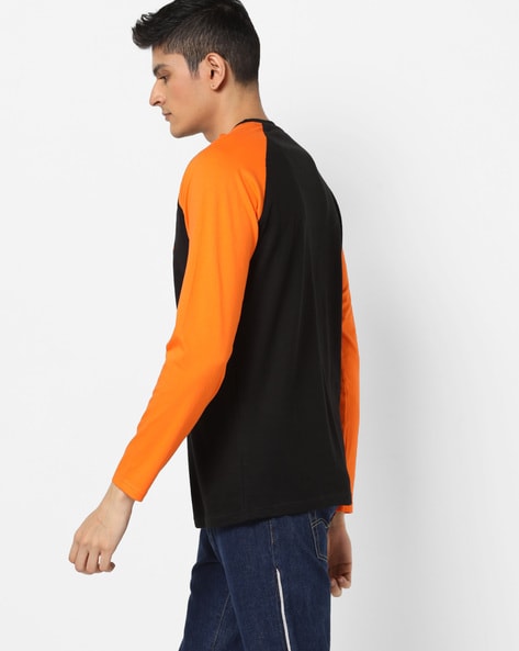 orange and black raglan shirt