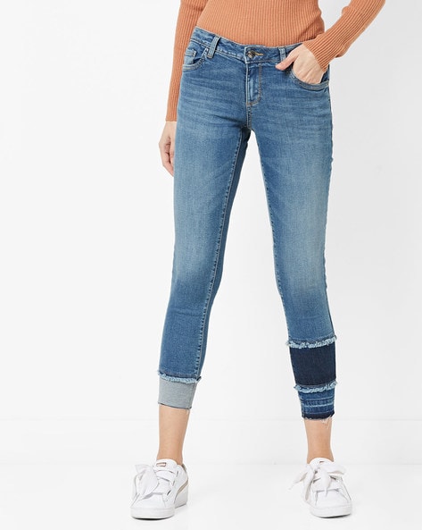blue distressed skinny jeans