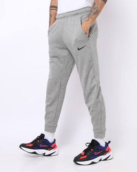 Buy Grey Track Pants for Men by NIKE 