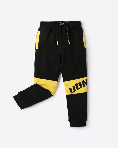 black and yellow joggers