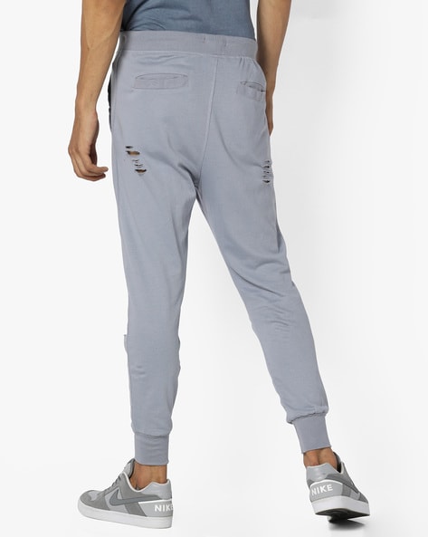 Ripped track hot sale pants mens