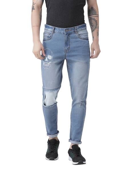 heavily ripped jeans