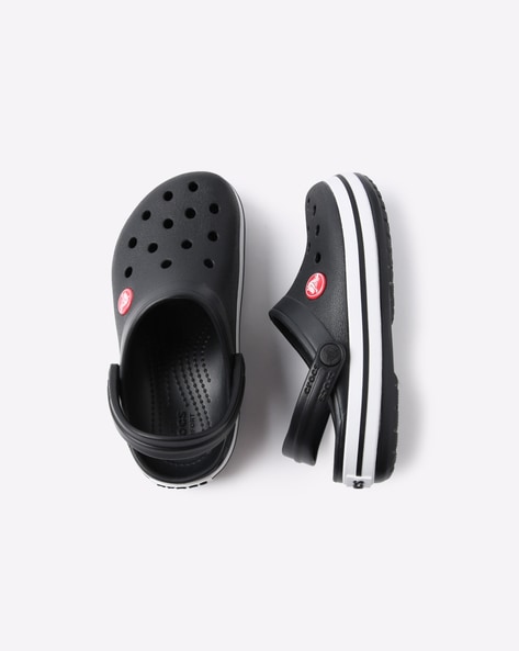 white crocs with black stripe