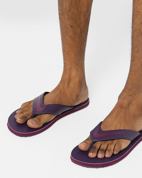 nike purple flip flops