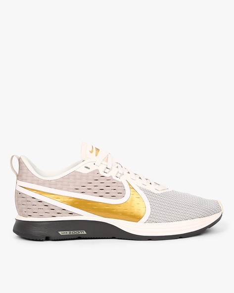 Nike zoom strike 2 2024 gold