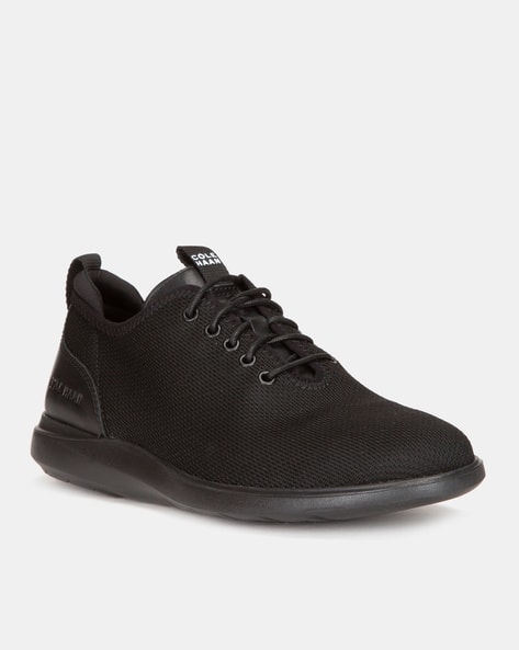 cole haan black slip on sneakers