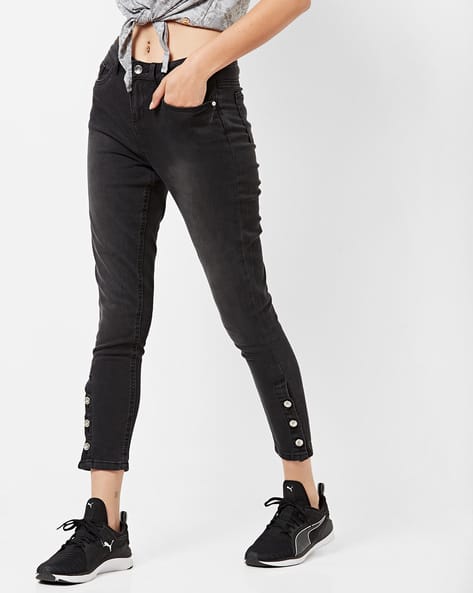 Light-Wash Skinny Jeans with Buttoned Hems
