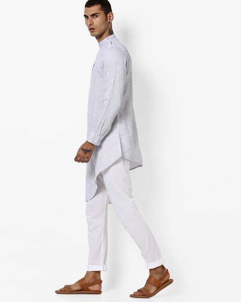 footwear on white kurta pajama