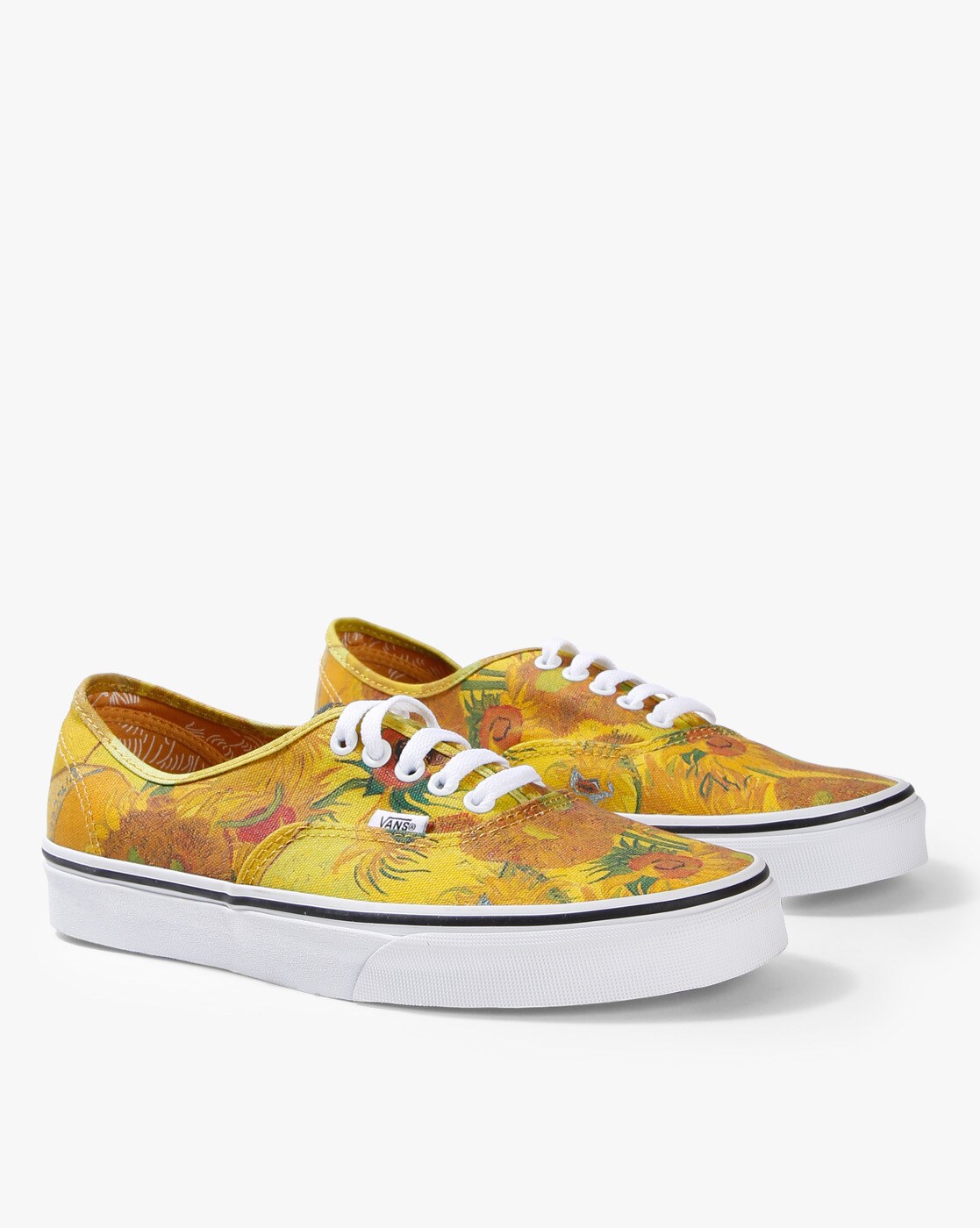 tan vans with flowers