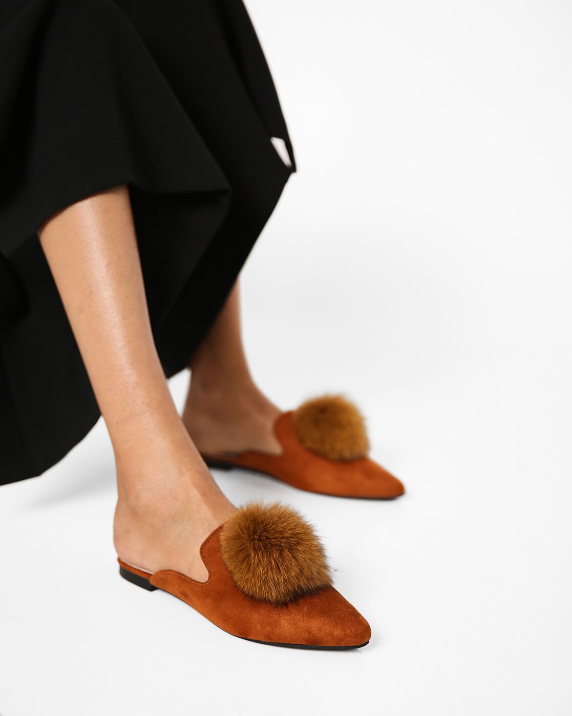 mules with pom poms