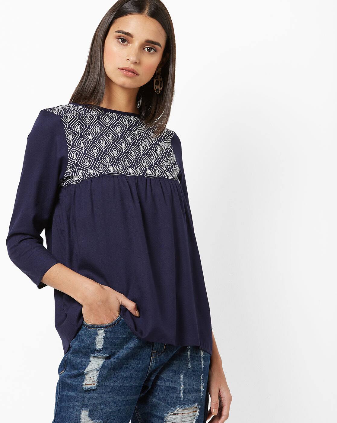 navy blue top and jeans