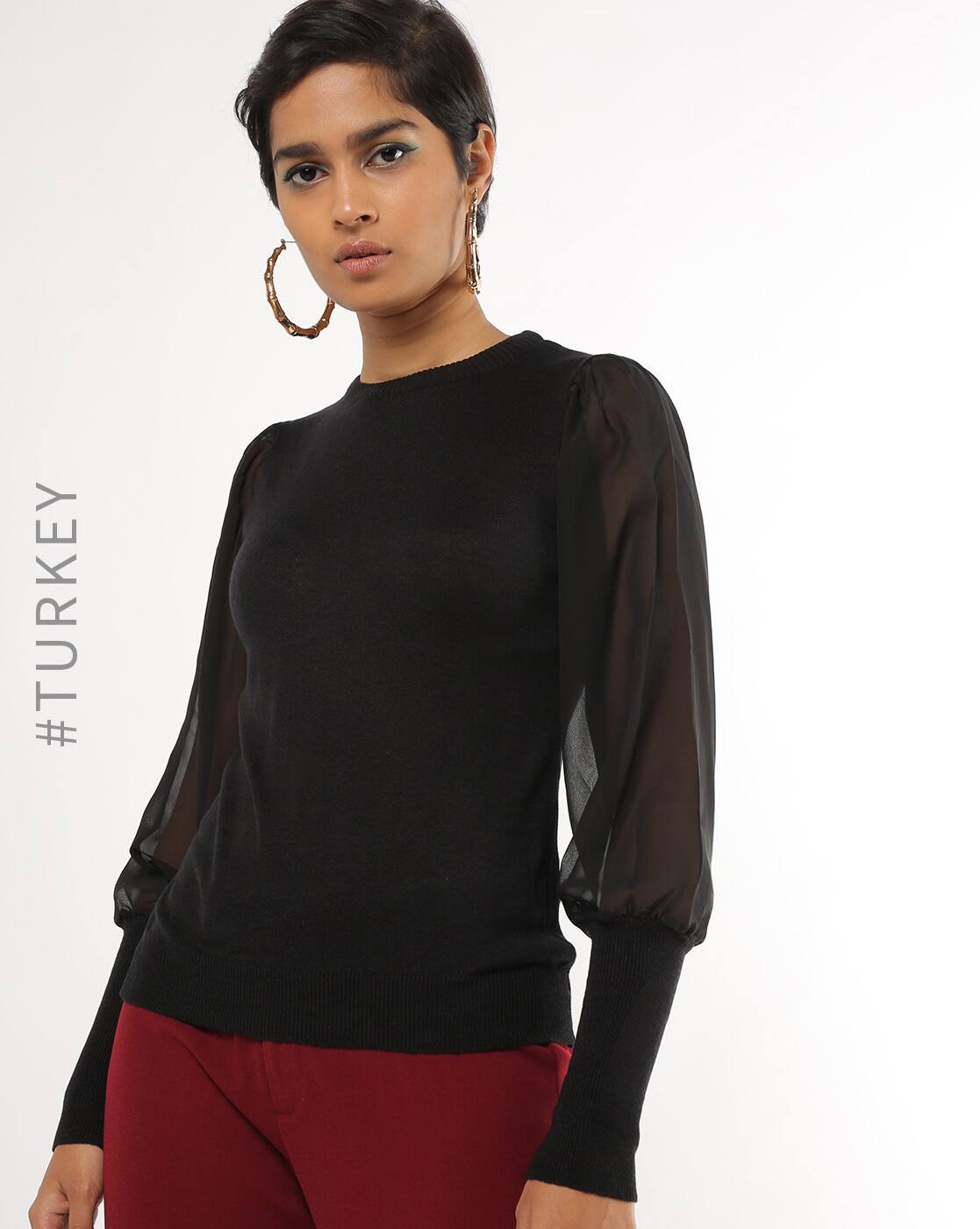 black sweater with sheer sleeves