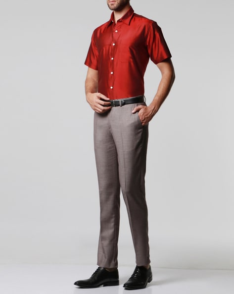 A man in a red shirt and grey pants photo – Free Sterling Image on Unsplash
