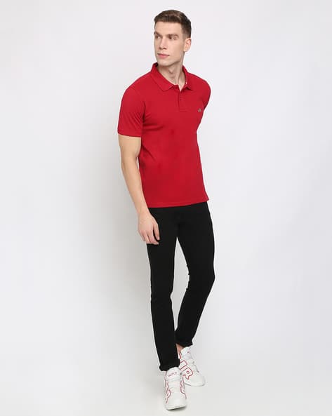 red t shirt and black jeans