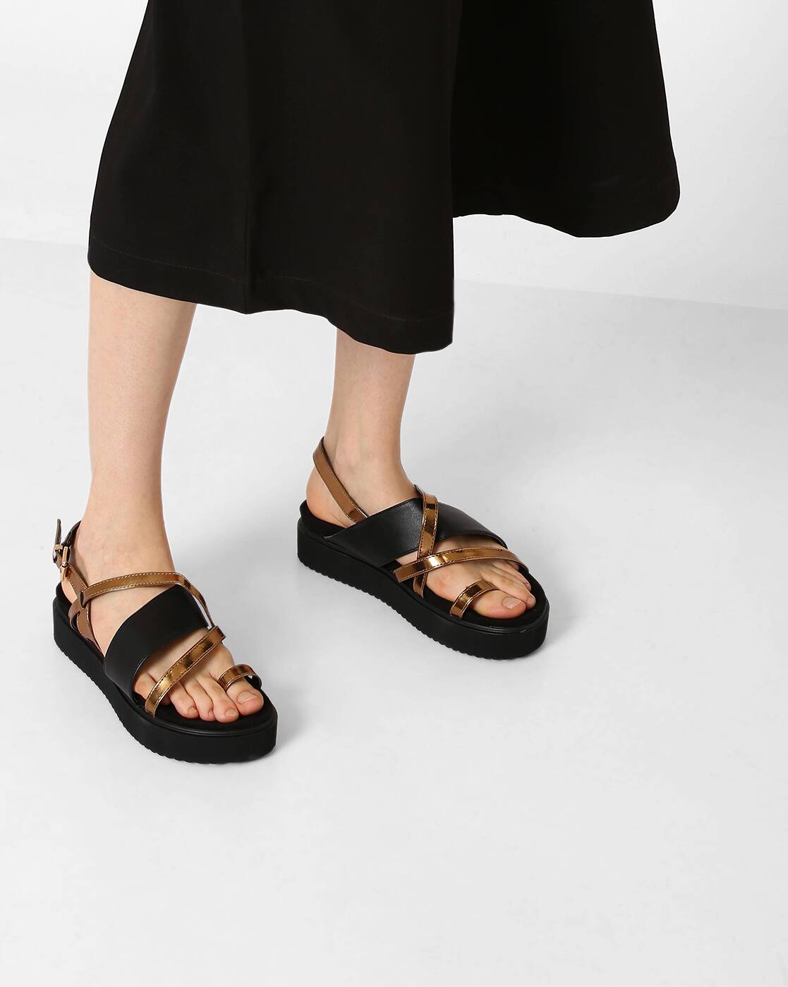 black and gold flatforms