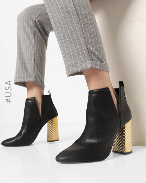 Black boots clearance with gold heels