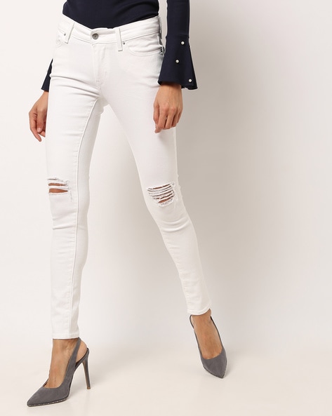 white distressed levi jeans