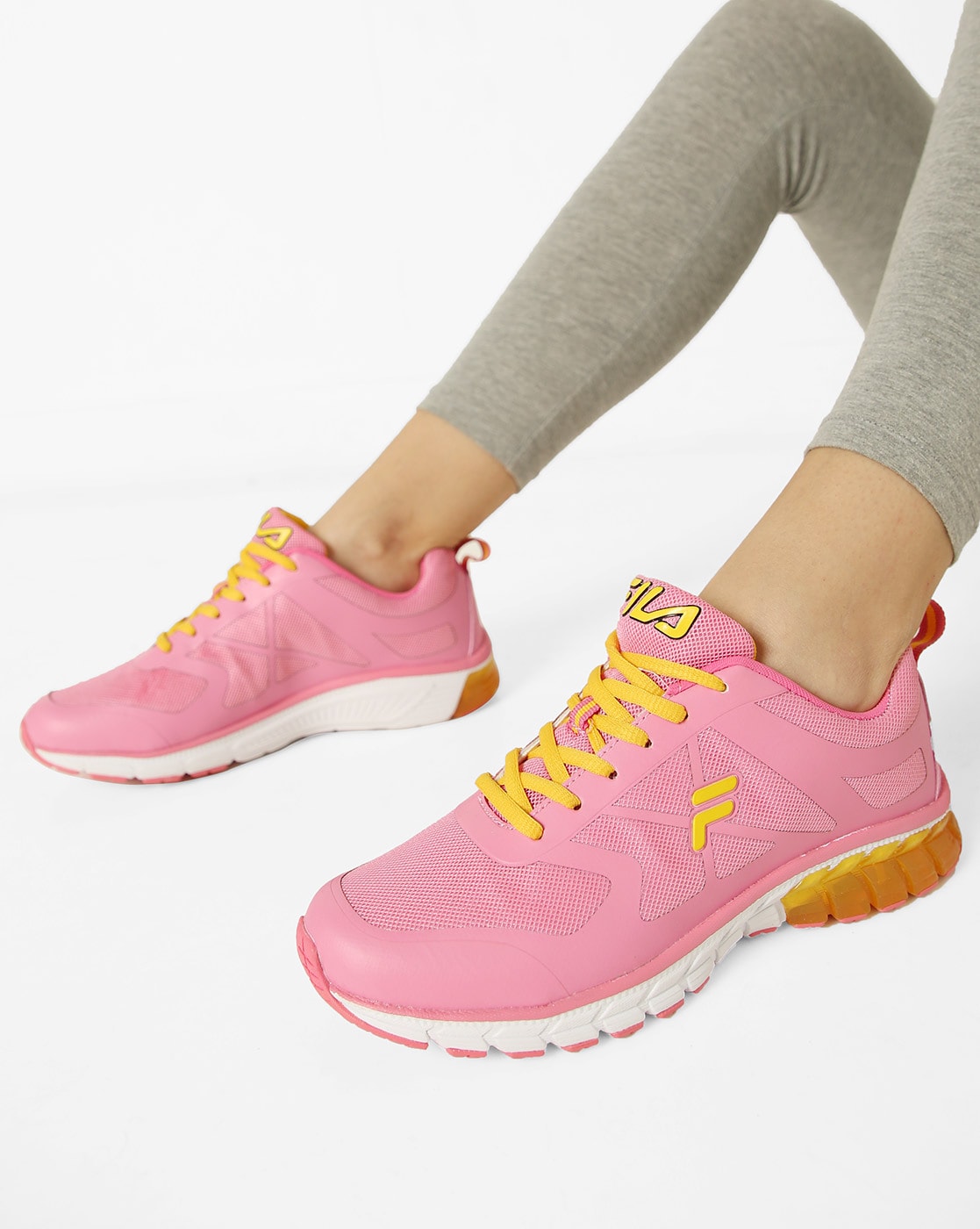 pink and yellow fila shoes