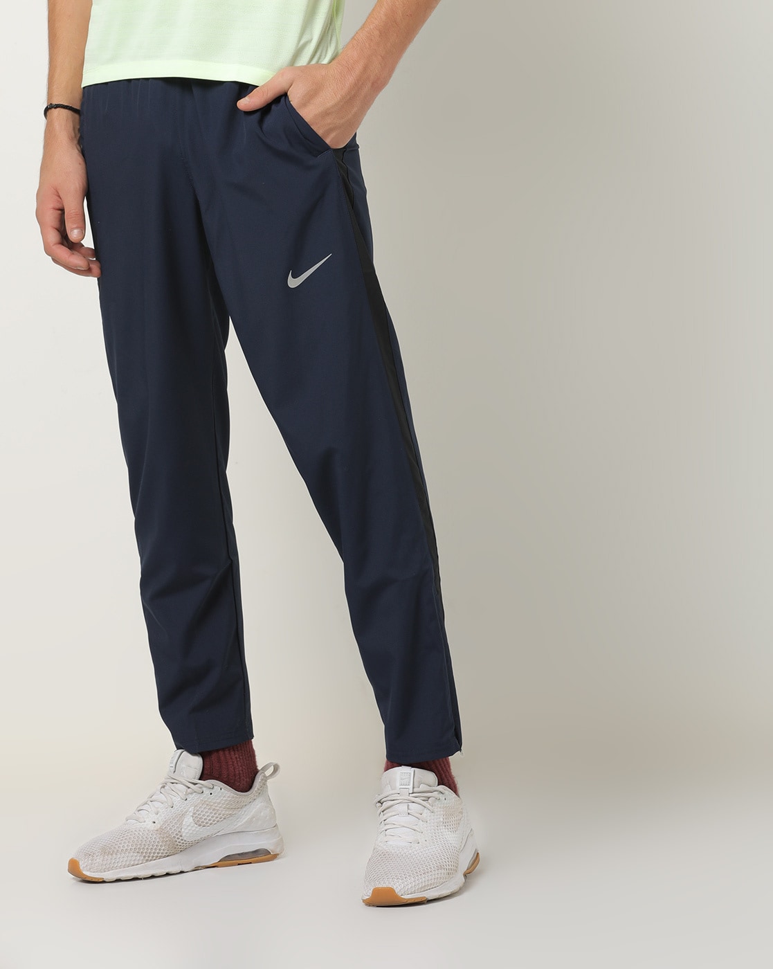nike track pants with stripe