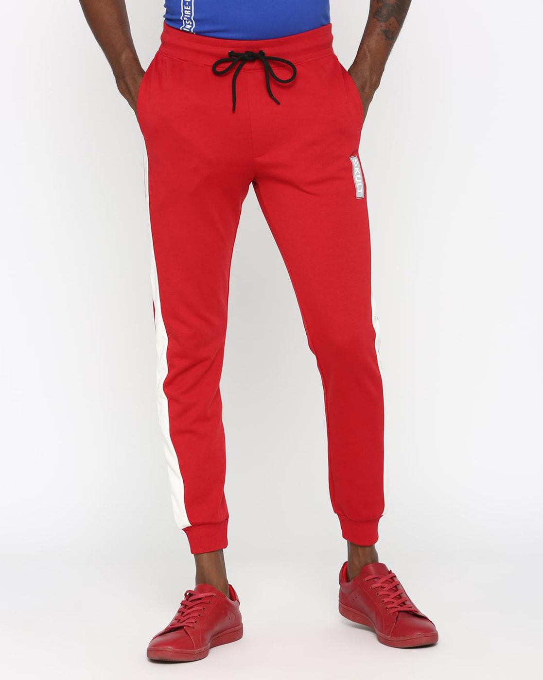 red joggers with white stripe