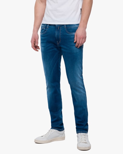 River Island high rise mom jeans with rips in bright blue | ASOS