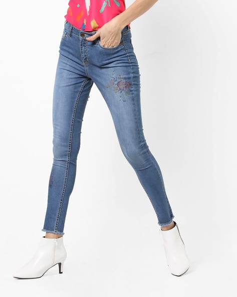 Mid-Wash Skinny Jeans with Floral Motif