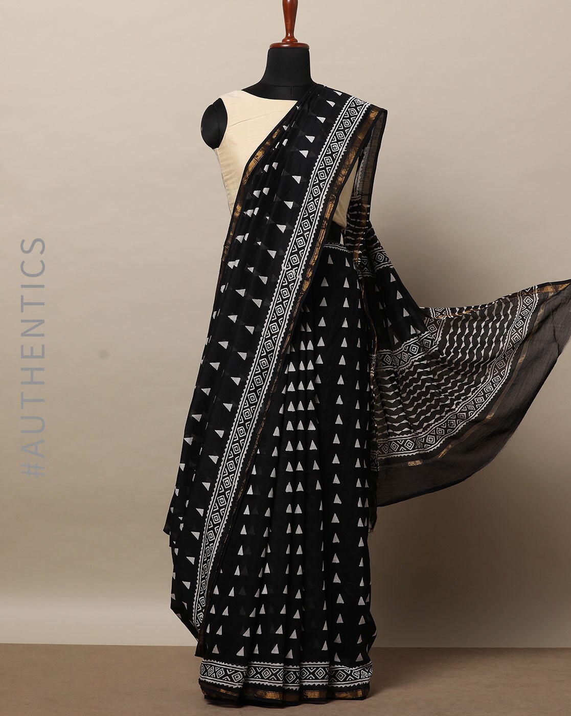 SURRAYIA A nod to the old school classics with traditional chunri print on  an exquisite black silk printed saree. Our black and white si